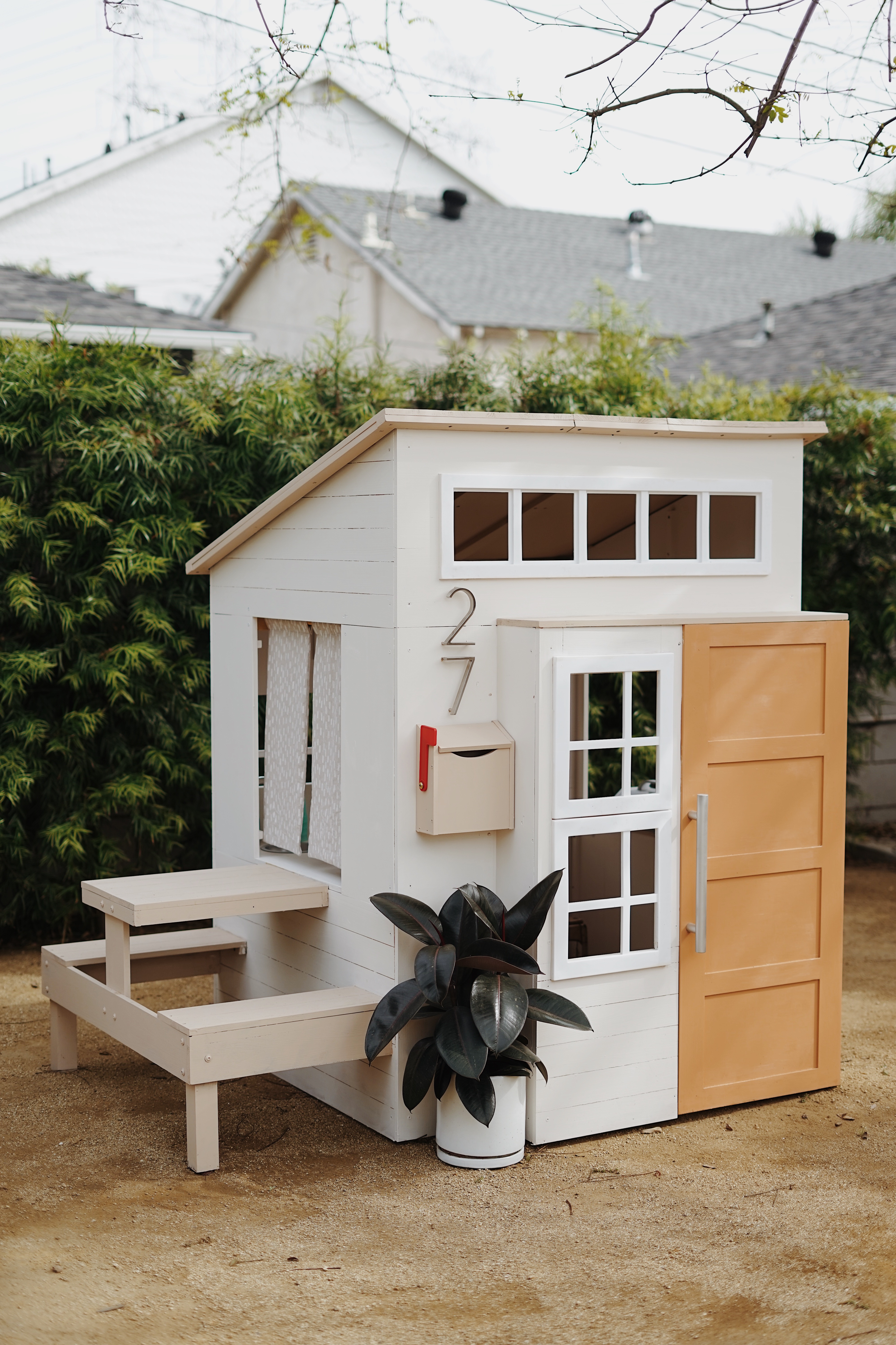 white wooden playhouse