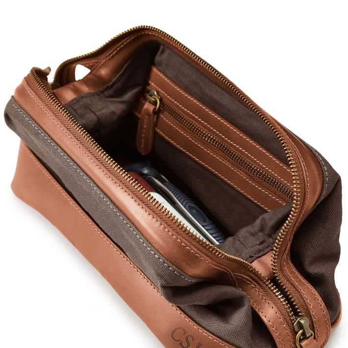 https://almostmakesperfect.com/wp-content/uploads/2022/06/beckett-waxed-canvas-and-leather-travel-pouch-o.png